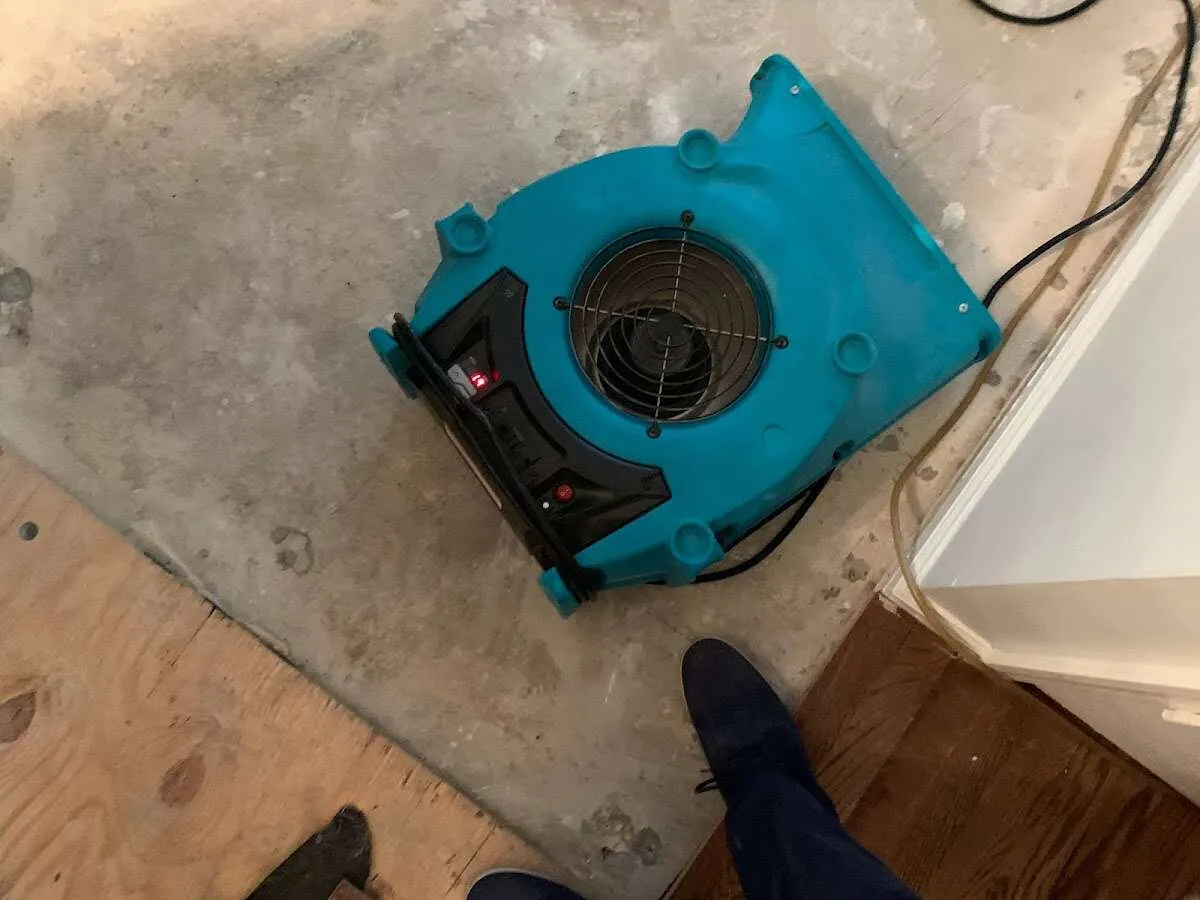 Air mover drying subfloor during Leak Detection & Repair in West Donegal